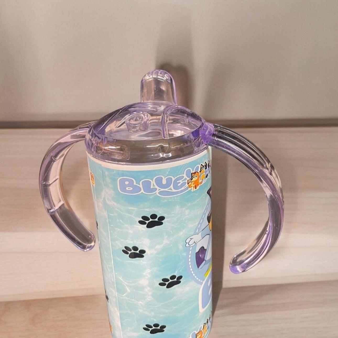 Character sippy cup with two lids and straw